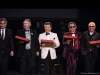 Dragons’ Den stars Bruce Croxon, Brett Wilson, Robert Herjavec, Michael Wekerle and Joe Mimran carry Boston Pizza boxes to the table of Jim Treliving, 2019 Inductee