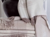Indulge in a faux fur throw from St. Pierre or a Marzotto cashmere blanket for instant comfort and sophistication