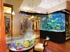 A calming aquarium wet bar combines innovation and tropical design in Frank McKinney’s latest feat.