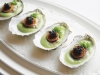 Huîtres & Caviar: The poached oysters are placed on a bed of leek velouté, then topped with toasted brioche and caviar.