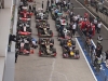 The F1 cars park for final inspection by officials after the race.