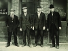 The four founders stand in front of the original Harley-Davidson workshop.