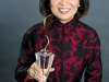 Helen Ching-Kircher proudly displays her 2009 Entrepreneur of the Year Award.