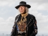 James Goldstein dons a jacket by designer Balmain while posing | Photography by Jesse Milns