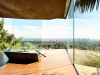 Goldstein’s bedroom is surrounded by retractable glass windows which overlook the Beverly Hills Crest | Photo by Derek Swalwell