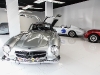 Miami Supercar Rooms’ dining experience allows guests to purchase a pod, where they can enjoy a custom five-course meal prepared by a local chef next to classic vehicles, such as a 1955 Mercedes-Benz 300 SL Gullwing and a 1958 Maserati 450 S vintage racing car (right). Each pod also comes with an associate who can answer any questions guests have about the car