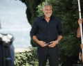 In a nod to Speedmaster’s racing heritage, Clooney is seen near his home on Lake Como, Italy, wearing the Speedmaster ’57 stainless steel model with a PVD blue dial | Photo Courtesy Of Omega