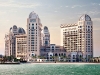 The extravagant St. Regis Doha Hotel is surrounded by the Arabian Gulf