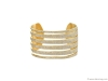 KARMA EL KHALIL: Available in an array of sizes, the classic Tiger Cuff replicates the stroke of a tiger’s claws, with six rows of differing sizes in 18-karat yellow gold filled with pave white diamonds | Photo courtesy of 1stdibs