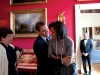 President Barack Obama hugs First Lady Michelle Obama  in the Red Room while Senior Advisor Valerie Jarrett smiles prior to the National Newspaper Publishers Association (NNPA) reception 3/20/09.