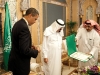 President Barack Obama looks at the King Abdul Aziz Order of Merit presented to him by Saudi King Abdullah bin Abdul Aziz at the start of their bilateral meeting at the King\'s Farm in Riyadh, Saudi Arabia, June 3, 2009.