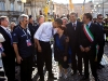 President Barack Obama greets bystanders, as he tours earthquake damage in L\'Aquila with Prime Minister Silvio Berlusconi while attending the G-8 summit in L\'Aquila, Italy, July 8, 2009.