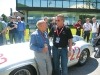 Jim Williams shares a moment with racing driver legend Stirling Moss, who was honoured in 2005 at Mille Miglia for coming out on top at its 1955 race.