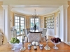 Floor-to-ceiling French doors lead from the breakfast nook to the west terrace garden