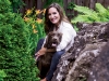 Amanda Lang takes a backyard break with her jogging partner Bella. Photography By Christoph Strube Of Judy Inc.