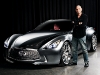 Cirque du Soleil founder Guy Laliberté standing by the Infiniti Essence concept car.