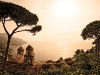 An orange glow cascades across Chiesa dell’Annunziata and the Amalfi Coast, seen from the Villa Rufolo Garden. Photo by Robert Leon