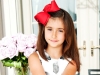 Connie loved wearing bows in her hair, especially her favourite red bow | Photo by Michael Francis Photographers