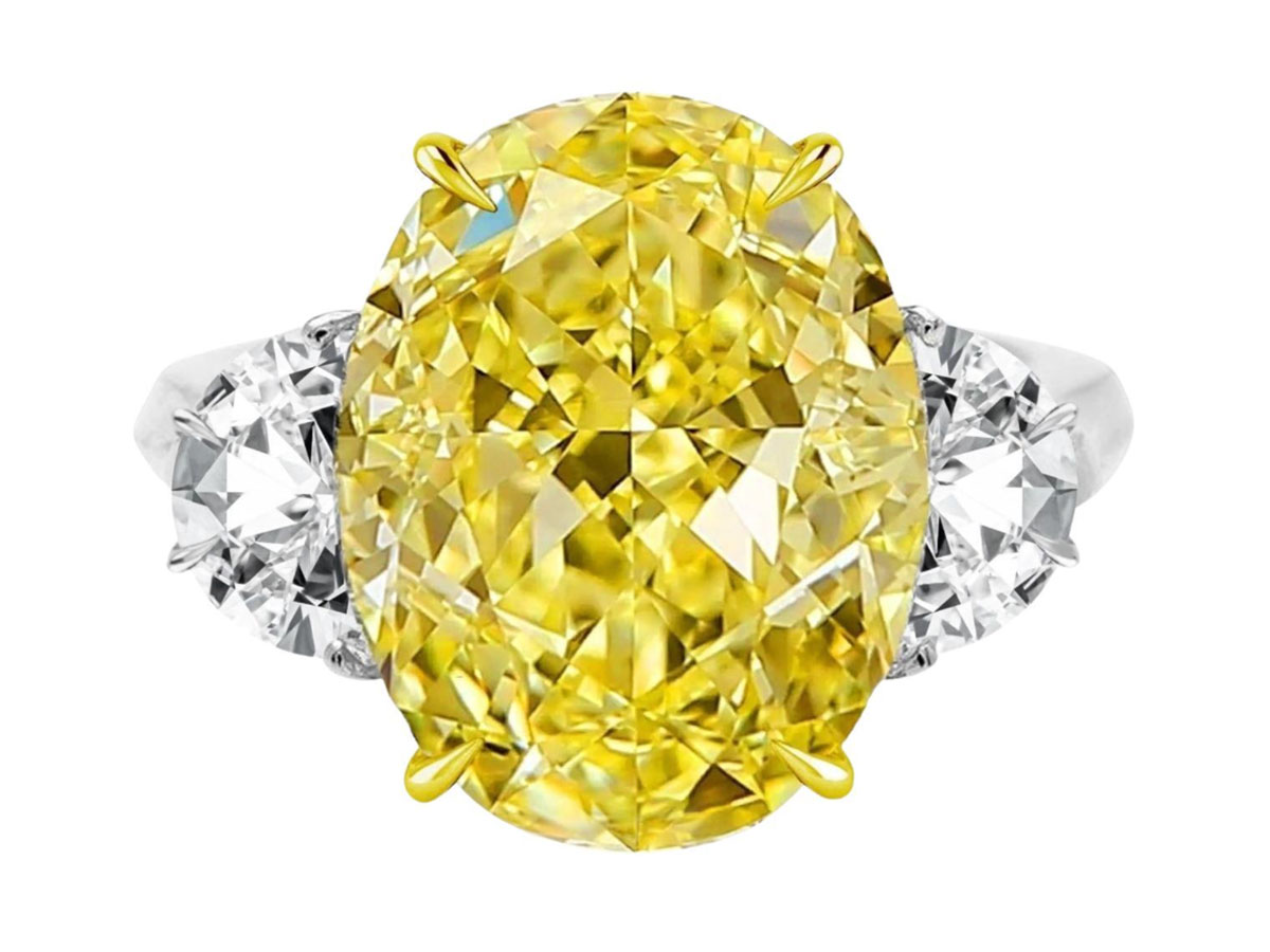 FANCY OVAL YELLOW DIAMOND RING